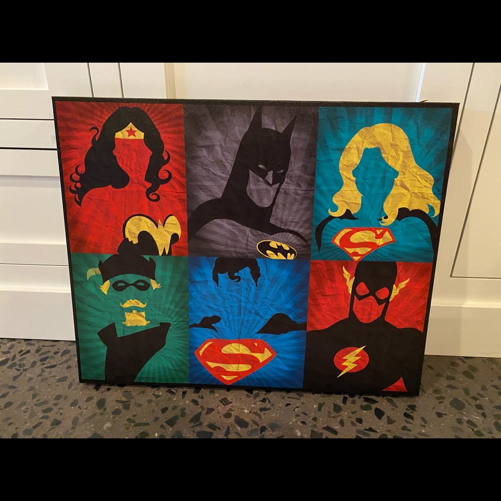 Two super hero art pieces.  Canvas and framed